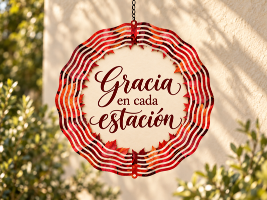 Gracia en cada estación lettering on an autumn-colored scalloped wind spinner.
